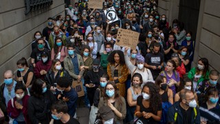 People gather in Barcelona, Spain, Sunday, June 7, 2020, during a demonstration over the death of George Floyd, a black man who died after being restrained by Minneapolis police officers on May 25. Photo: Emilio Morenatti/AP